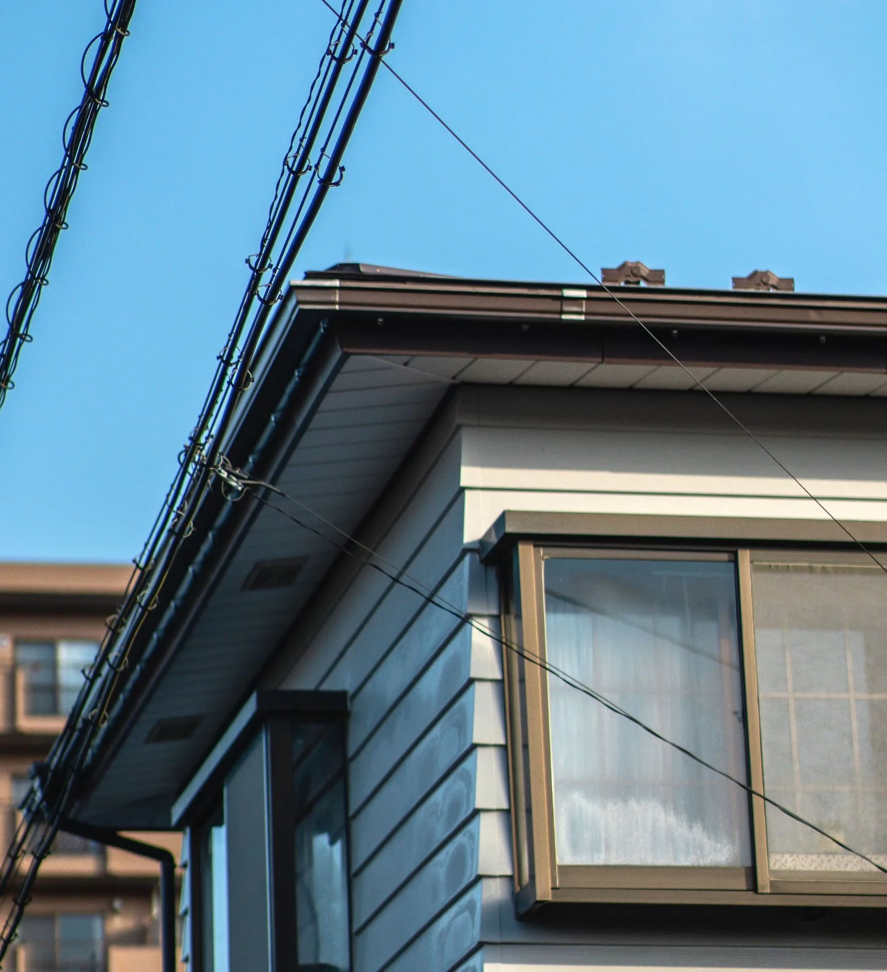 The exterior of a home with nearby power lines